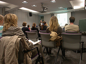 Course participants following a lecture in a class room